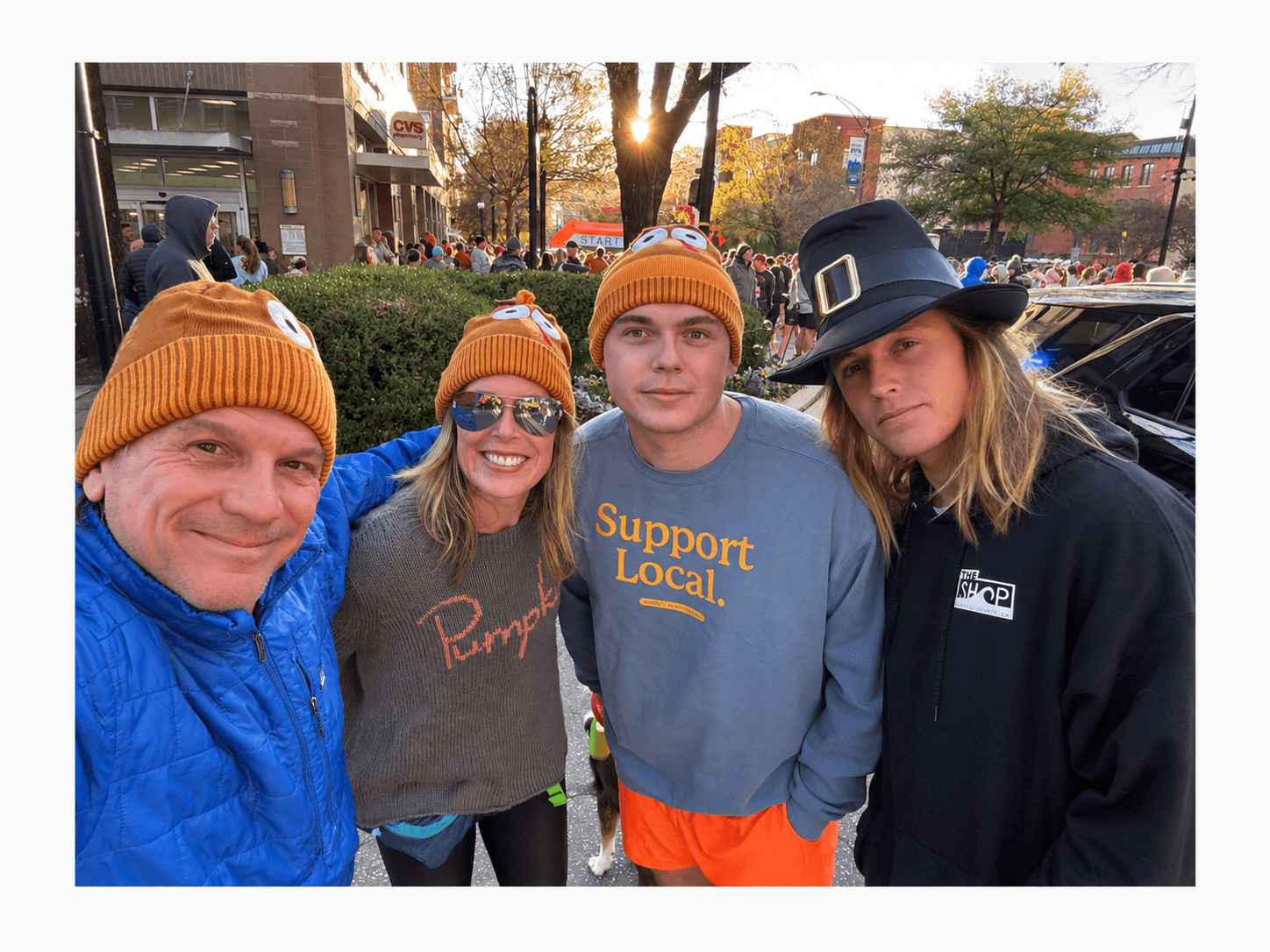 Luke with his parents and oldest brother Noah at the annual turkey trot