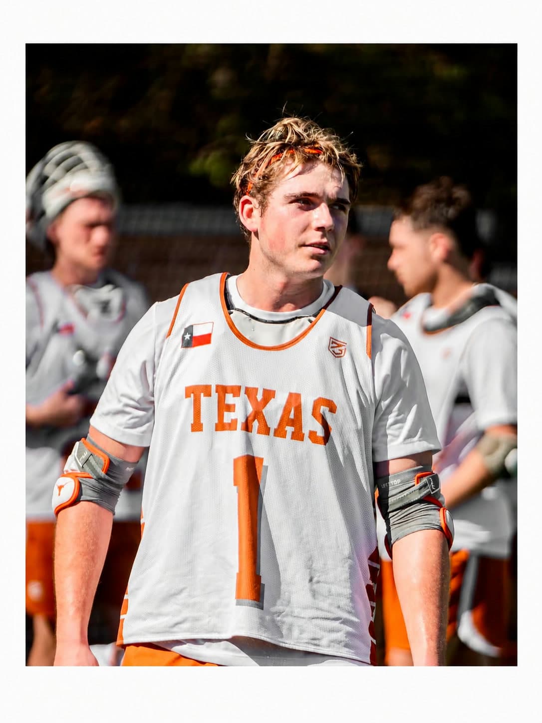Luke on the sideline in a Texas lacrosse jersey